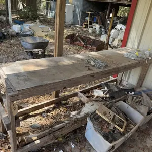 Wooded work table. Bottom shelve is broken.