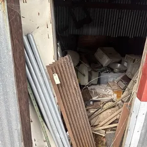 Storage room with scrap metal and computer parts.