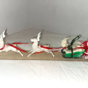 Vintage cardboard and plastic Santa with sleigh and reindeer