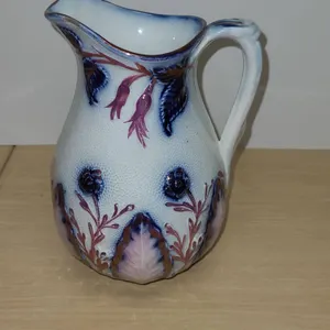 Porcelain Pitcher with Floral Relief and Pink Lustre Accents