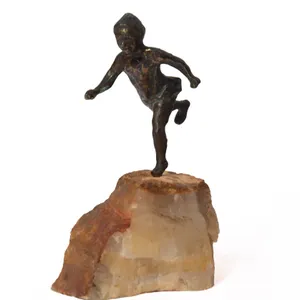 VINTAGE BRONZE SCULPTURE OF CHILD ON QUARTZ POSSIBLY BY CURTIS JERE.