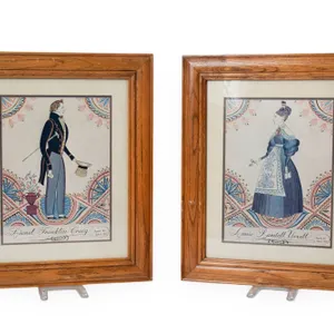 TWO HAND PAINTED CHROMOLITHOGRAPH PRINTS FRAMED IN WOODEN FRAMES.