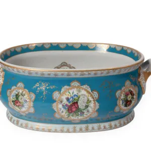 LIMOGES PORCELAIN FOOT BATH WITH FLORAL MOTIFS.