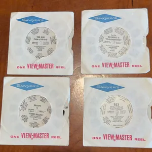 Four 1950s Sawyers view master reels. Includes Yogi Bear Bullwinkle, Chile Willie, and Droopy.