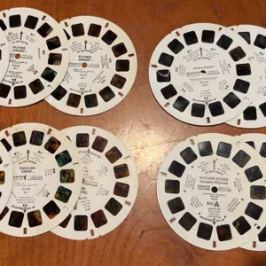 Four complete three real sets for view Masters. Flying Smurf and others