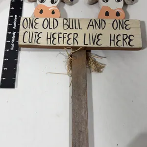 Hand-painted wooden rustic farm sign featuring two cow heads and the phrase "One old bull and one cu