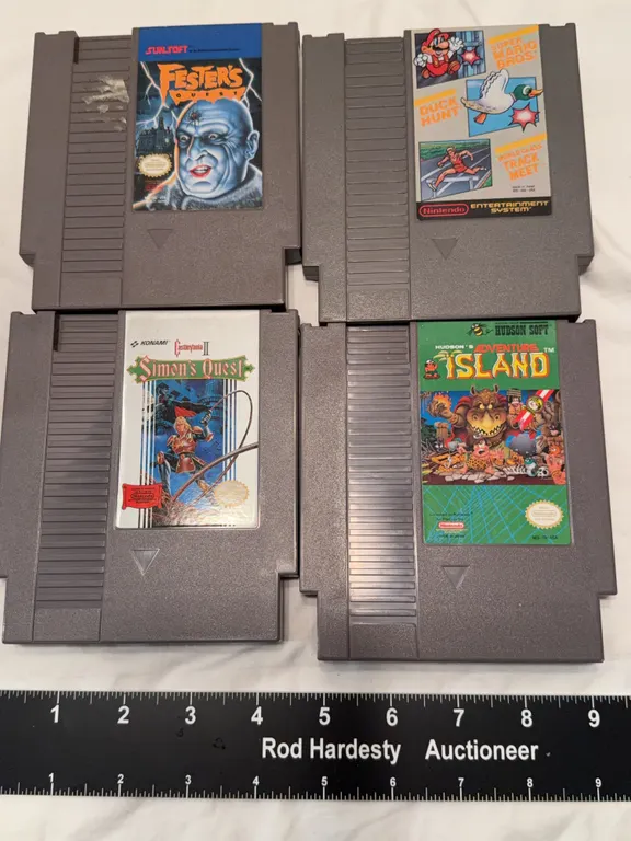 Four classic Nintendo Entertainment System (NES) game cartridges: