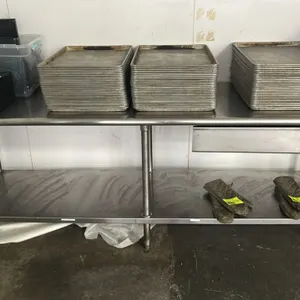 Stainless steel work table. Features an undershelf, single under-mount drawer, and bullnose front and rear edge. 96" x 30". Mounted on (6) tubular sta