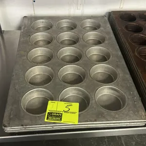 15-cup metal muffin pans. Features commercial metal construction with a 3 x 5 cavity layout per pan.