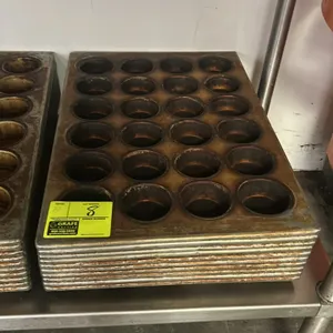 24-cup metal muffin pans. Features commercial metal construction with a 4 x 6 24-compartment layout.