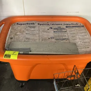 Ecolab SuperSoak System mobile soaking tank. Features orange polyethylene construction, integrated handle, lid with bilingual operating instructions, 