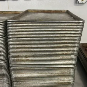 Metal full-size sheet pans. Commercial baking pans featuring wire-reinforced beaded rims.