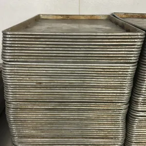 Metal full-size sheet pans. Features wire-reinforced rolled rim construction for commercial baking, roasting, and food service prep.