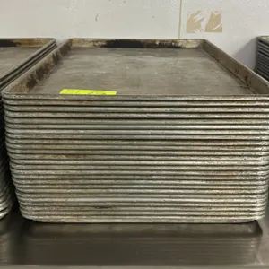 Metal full-size sheet pans. Features wire-reinforced rolled rims. Stainless steel table not included.