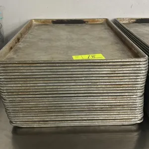 Metal full-size sheet pans. Features wire-reinforced rolled rims. Designed for commercial baking and food preparation.