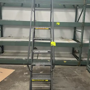 Tri-Arc 5' rolling safety ladder. Features 6-step steel construction with perforated slip-resistant treads, tubular handrails, top guardrail, and foot