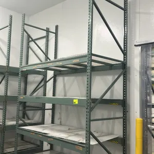 Interlake multi-tier teardrop pallet racking. Features teardrop punched uprights, 5" crossbars, and wire mesh decking across 4 shelf tiers. Dimensions