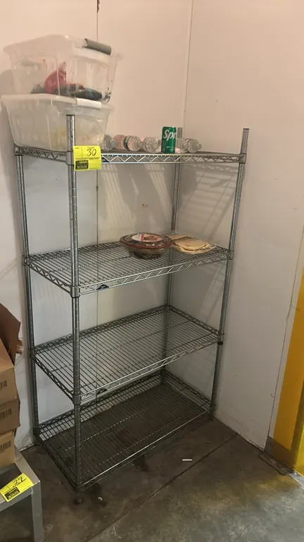 Metro 4-tier wire shelving rack. Features 4 adjustable wire shelves and chrome finish. 36"W x 18"D. Mounted on leveling feet. Contents not included.