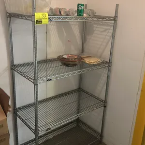 Metro 4-tier wire shelving rack. Features 4 adjustable wire shelves and chrome finish. 36"W x 18"D. Mounted on leveling feet. Contents not included.