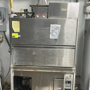 Hobart UW50 stainless steel commercial utensil and pan washer. Features drop-down door, interior wire rack, and top-mounted gauges. S/N: 85-1078504. E