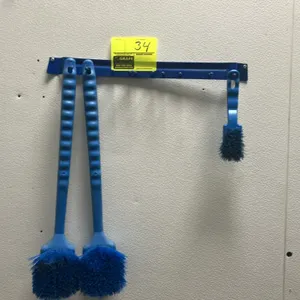 Cleaning brush set with wall-mounted utility rack. Includes (2) long-handle scrub brushes and (1) short-handle scrub brush. Features a blue painted me