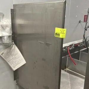 Stainless steel wall-mounted divider panel. 30" x 42". Features stainless steel construction with integrated mounting bracket. Sink and surrounding it