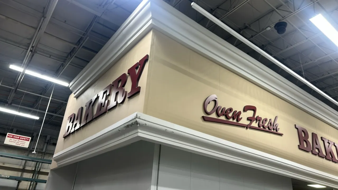 Quantity of walk-in panels with decorative facade and signage. Features white insulated wall panels, upper facade trim with crown molding, and dimensi