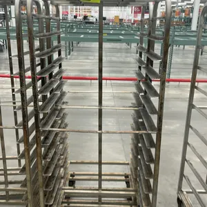 Aluminum full-size side-load oven racks. Features multi-tier angle slide runners and top guide brackets. Mounted on swivel casters.