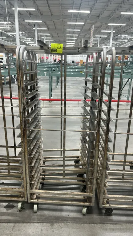 Aluminum full-size side-load roll-in oven racks. Features top lift bracket attachment, multi-tier angle slide runners, and welded aluminum constructio