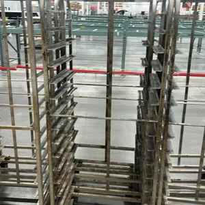 Aluminum full-size side-load oven racks. Features angle pan slides and top rack oven lift brackets. Mounted on swivel casters.