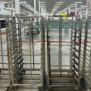 Aluminum full-size side-load oven racks. Features multi-tier pan slides and side-loading design. Mounted on swivel casters.