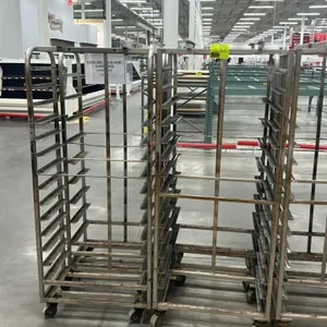 Aluminum full-size side-load oven racks. Features aluminum tubular construction with multi-tier angle slides for sheet pans. Mounted on swivel casters