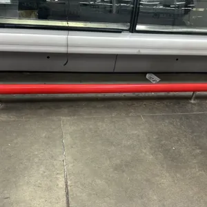 Metal safety guardrails. Features red tubular metal construction. Includes (1) 12'L rail and (1) 8'L rail. Floor-mounted posts. Display cases not incl