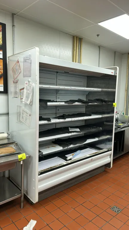 Arneg PL05-1-6 multi-tier medium-temp open display case. Features multi-tier adjustable solid shelving and interior canopy lighting. 6'L. S/N: U110323