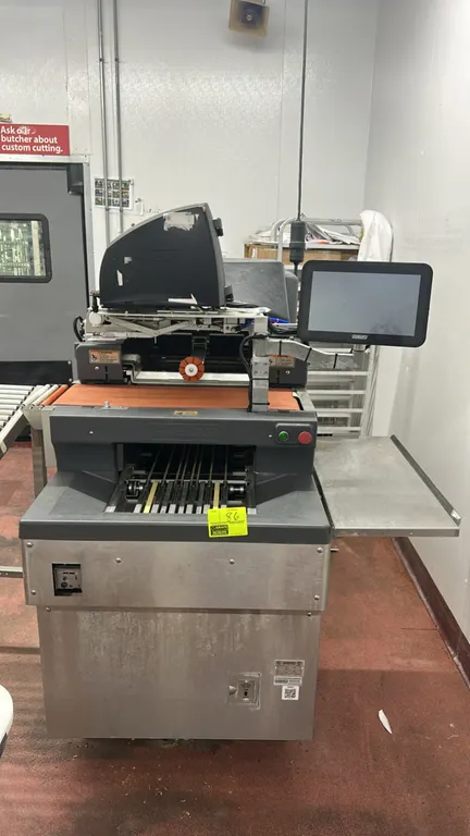 Hobart NGW2 commercial automatic stretch film tray wrapper. Features stainless steel construction, integrated touchscreen display, automatic label app