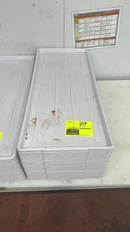 Poly display trays. Features white molded plastic construction with ribbed bottoms. Dimensions: 30" x 13".
