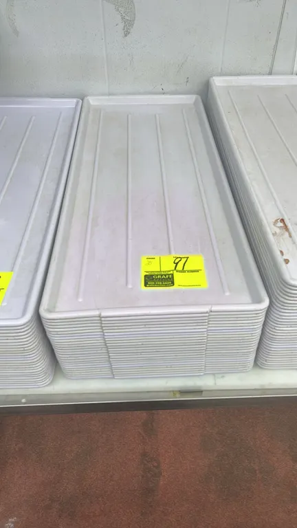 Poly display trays. Features white molded plastic construction with ribbed interior surfaces and raised rims. Dimensions: 30" x 13".