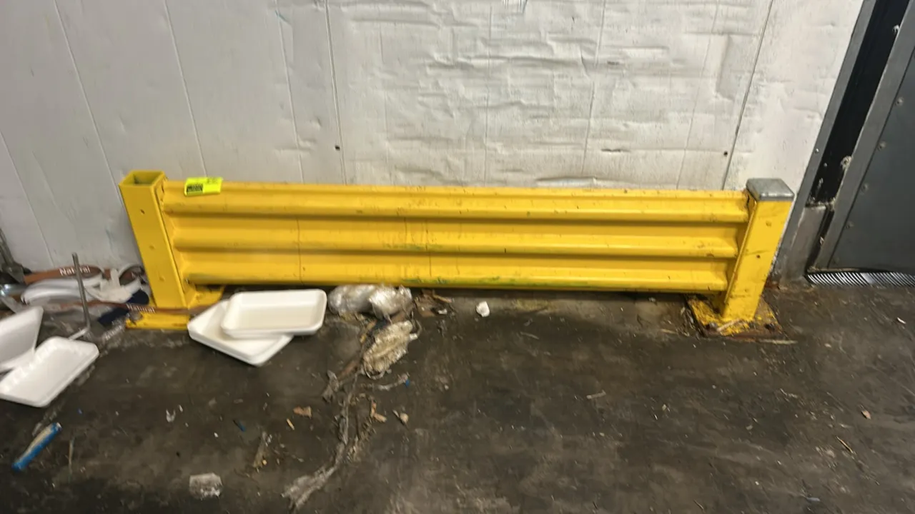 Metal safety guardrail. Features yellow finish corrugated rail with two upright posts. 6'L. Base plates with holes for floor mounting.