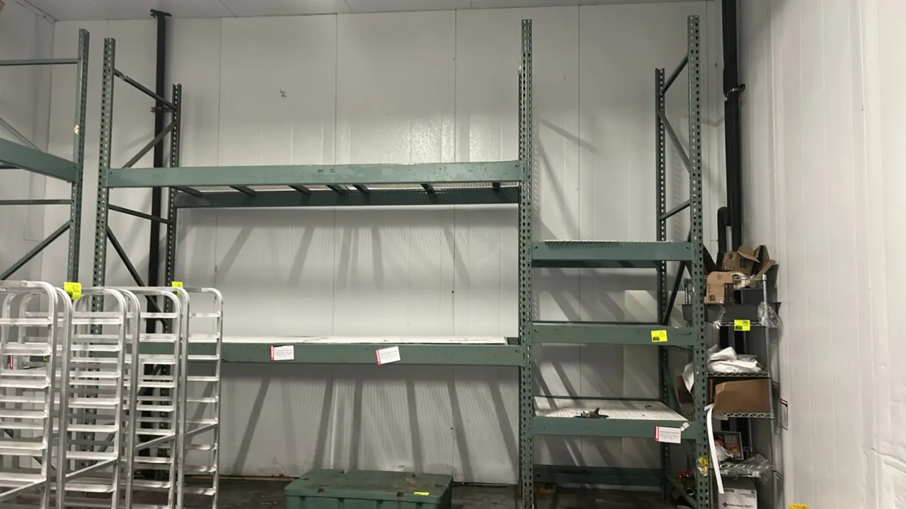 Interlake teardrop pallet racking bays. Features multi-tier configuration, wire mesh decking, 6" crossbars, and 5" crossbars. Dimensions: (1) 129" x 4