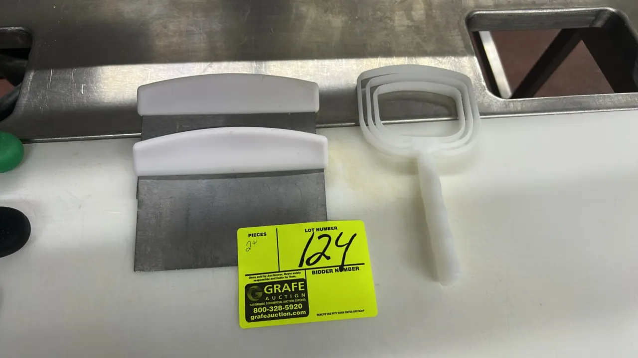 Stainless steel scrapers and poly scraper. Features stainless steel blades with white poly handles. Includes molded white poly scraper.