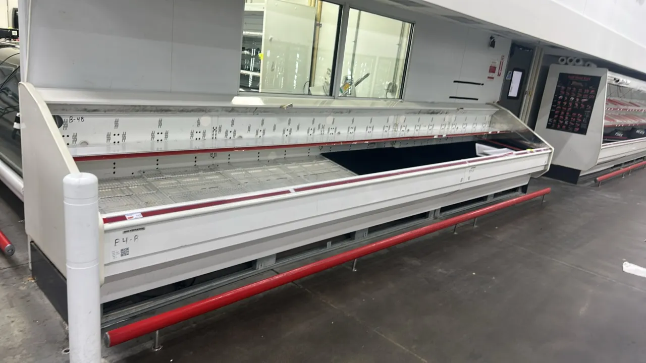 Hillphoenix O2UM8 remote open-air grab and go display cases. Features solid upper shelving, lower deck display area, interior lighting, and protective