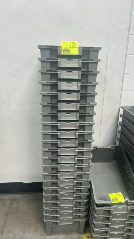Poly crates. Features gray molded plastic construction, ventilated side walls, solid bottoms, integrated handles, and stackable design. 24"L.