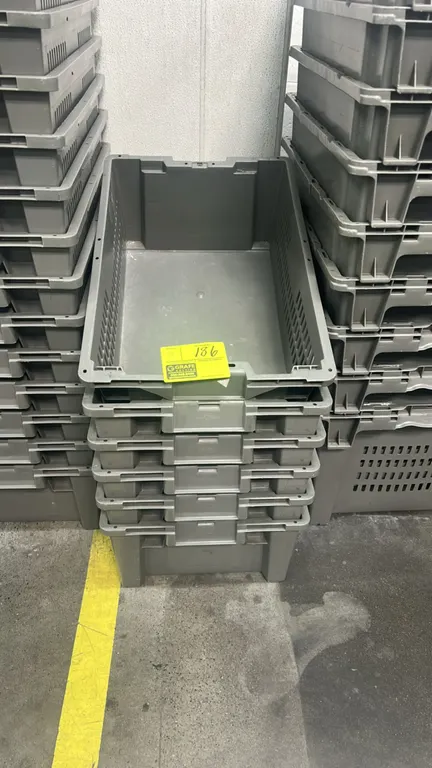 Poly crates. Features gray molded plastic construction, vented side walls, and stackable design. 24".