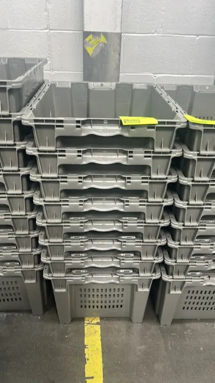 Poly crates. Features stackable and nestable gray molded plastic construction with integrated carry handles. 24".