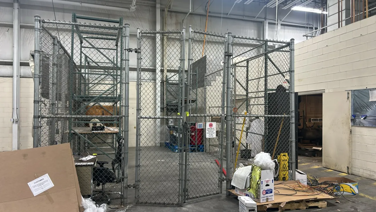 Chain-link security cage enclosure. Features galvanized steel tubular framing, chain-link wire mesh panels, and (2) swing gate doors. 26' x 15 1/2' x