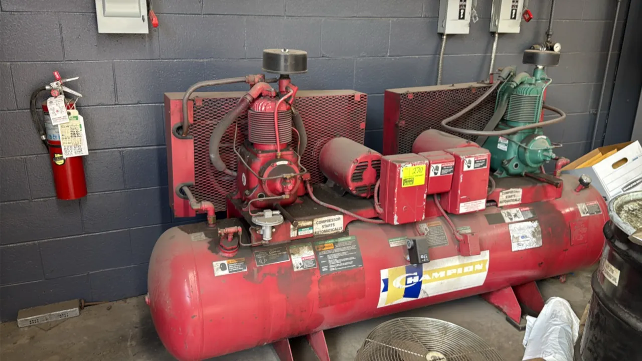 1996 Champion 112-gallon duplex horizontal shop air compressor. Features dual compressor pumps, dual electric motors, belt-drive system with wire mesh