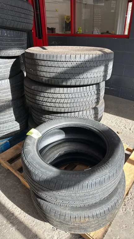 Assorted vehicle tires. Includes Firestone Transforce HT2, Bridgestone Alenza Sport A/S, and other assorted brands and tread designs. Pallet not inclu