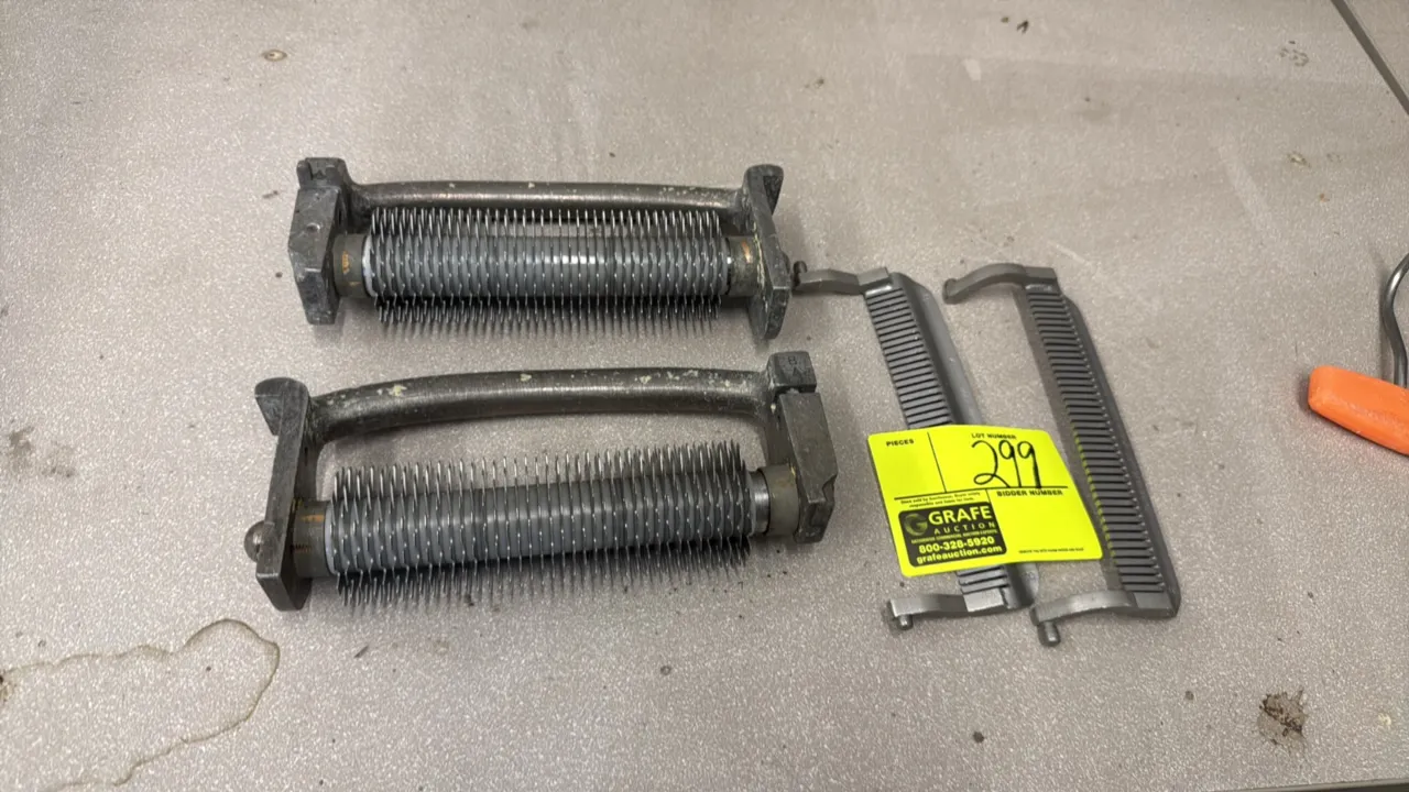 Hobart 403 meat tenderizer cuber blade assembly. Includes (2) circular knife roller assemblies and (2) stripper combs.