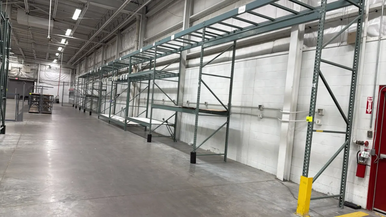 Interlake warehouse racking. Features teardrop uprights, cross beams, and wire mesh decking. Dimensions: 10'9" x 3'8" x 12'6"H. Contents not included.
