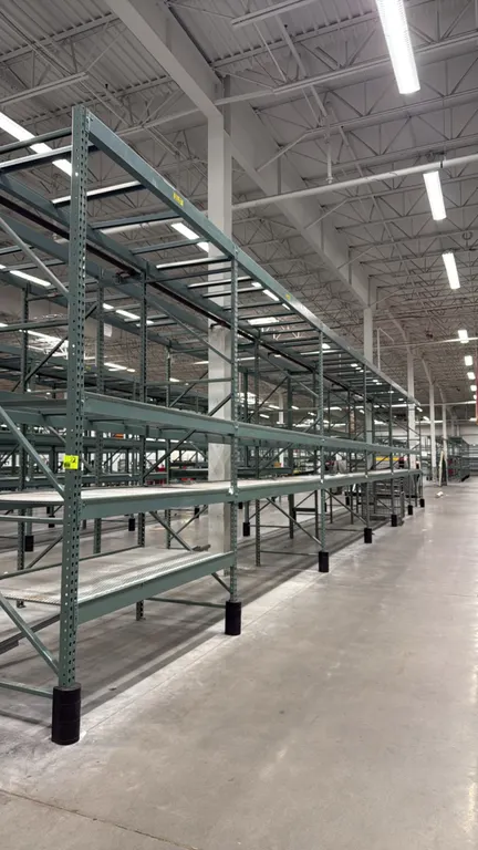 Interlake warehouse pallet racking. Features teardrop uprights, step beams, and expanded metal wire decking. Includes (1) 7'6"L bay and (5) 10'9"L bay